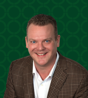 Photo of Rob Houck on a green background.